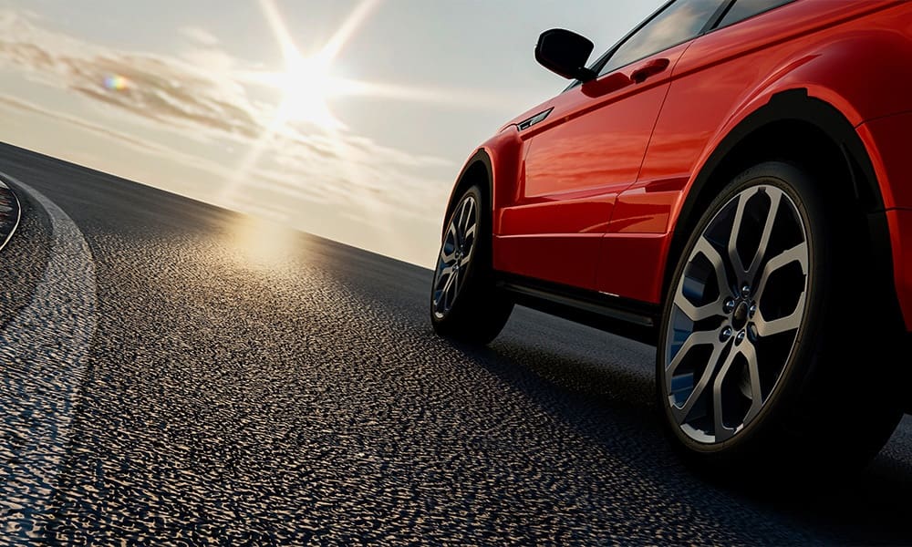How New Iowa Laws Could Affect Your Auto Insurance - Car Sedan Rides on the Road to Meet the Sun